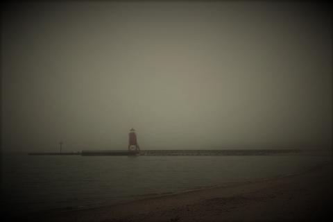 Foggy night with lighthouse